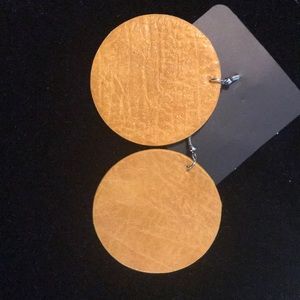 Yellow (Golden tone) leather earrings.